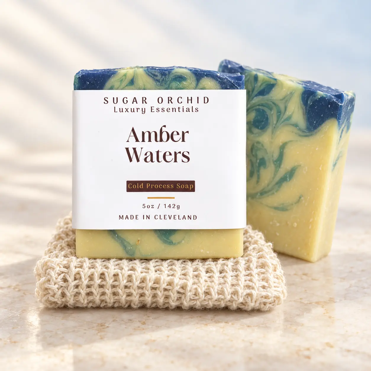 Labeled Amber Waters soap with a natural soap saver